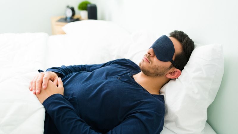 Man sleeping with eye mask
