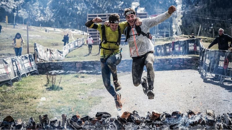 Two athletes jumping in Spartan race